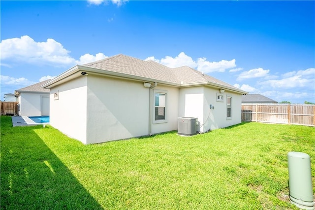 1306 E Danielle Ave, Pharr, TX 78577 - back of property with central air condition unit, stucco siding, and roof with shingles