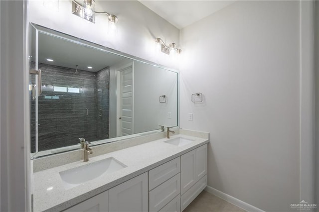 1306 E Danielle Ave, Pharr, TX 78577 - full bathroom with double vanity, tiled shower, and baseboards