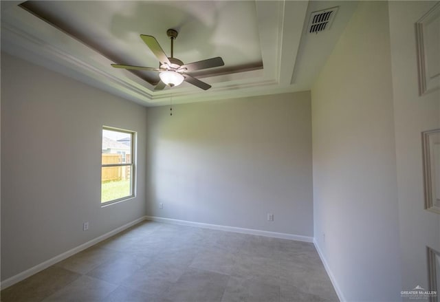 1306 E Danielle Ave, Pharr, TX 78577 - spare room with a tray ceiling, ceiling fan, and baseboards