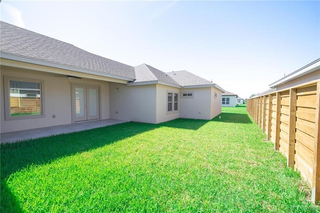 1306 E Danielle Ave, Pharr, TX 78577 - rear view of property with stucco siding, a shingled roof, and ceiling fan