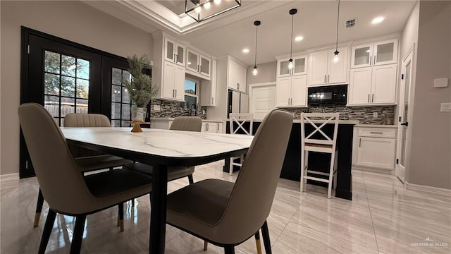 dining area with light tile patterned flooring