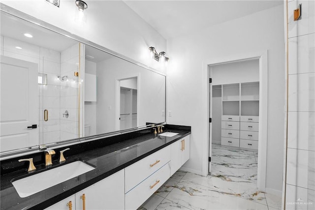full bathroom with a sink, double vanity, a stall shower, and marble finish floor
