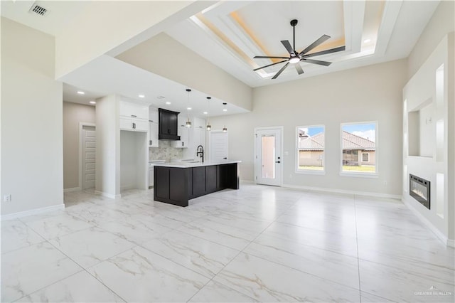 2400 Windmill Palm, Rio Grande City, TX 78582 - kitchen featuring a sink, an island with sink, open floor plan, light countertops, and visible vents