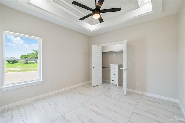 2400 Windmill Palm, Rio Grande City, TX 78582 - unfurnished bedroom featuring a ceiling fan, a closet, marble finish floor, a raised ceiling, and baseboards
