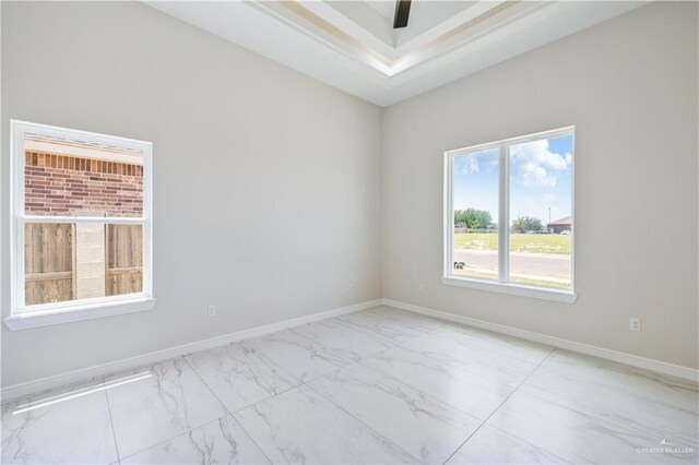 2400 Windmill Palm, Rio Grande City, TX 78582 - unfurnished room featuring baseboards, marble finish floor, and a raised ceiling