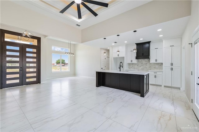 2400 Windmill Palm, Rio Grande City, TX 78582 - kitchen featuring hanging light fixtures, a sink, a spacious island, marble finish floor, and light countertops