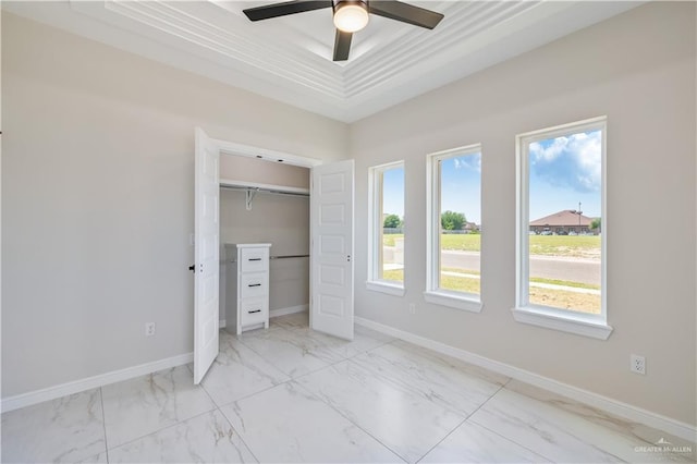 2400 Windmill Palm, Rio Grande City, TX 78582 - unfurnished bedroom featuring marble finish floor, baseboards, a closet, and a raised ceiling