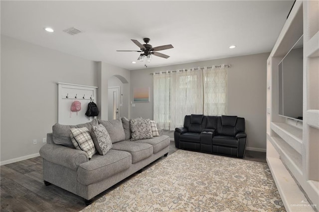 5116 Escondido Pass, Mcallen, TX 78504 - living room featuring a ceiling fan, visible vents, baseboards, dark wood-type flooring, and arched walkways