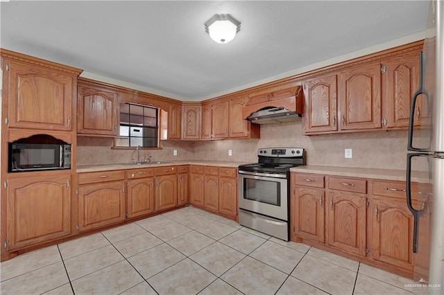 kitchen featuring tasteful backsplash, ventilation hood, stainless steel appliances, sink, and light tile patterned flooring