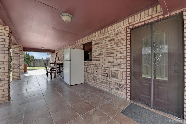 entrance to property featuring a patio