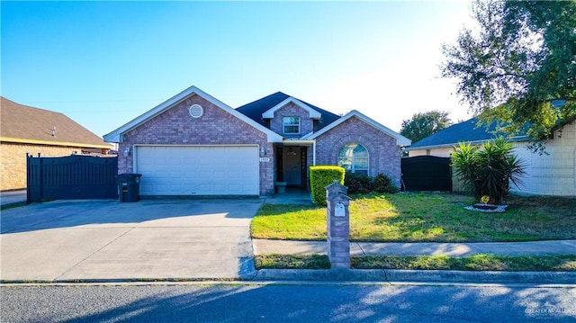 view of front of property with a front yard and a garage