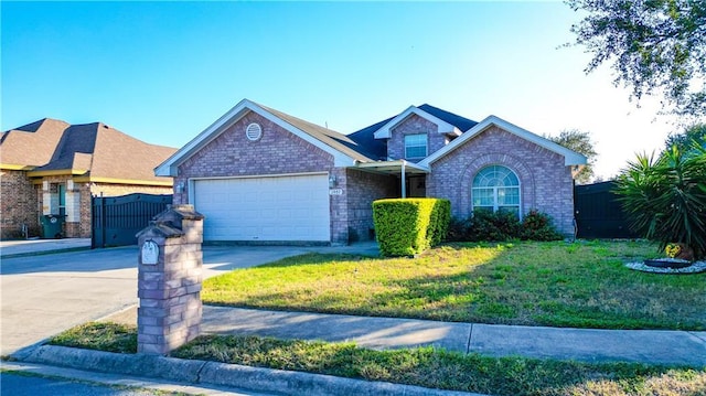 view of front of home featuring a garage and a front lawn