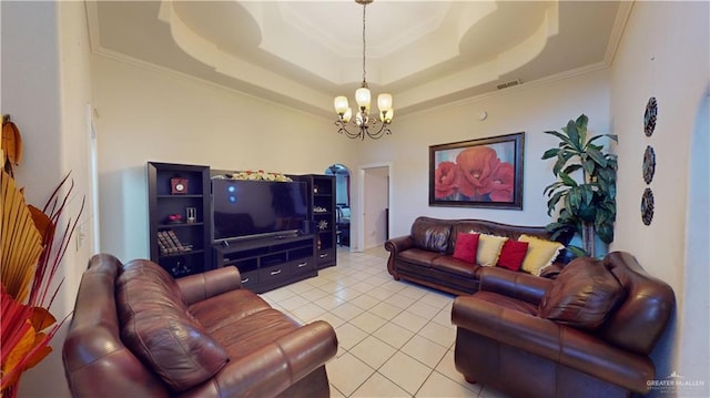 tiled living room with an inviting chandelier, a raised ceiling, and crown molding