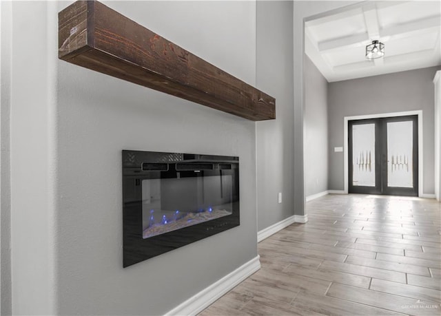 entryway with light hardwood / wood-style flooring and french doors