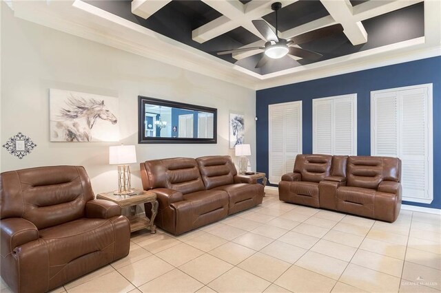 living area featuring light tile patterned floors, ceiling fan, coffered ceiling, beamed ceiling, and crown molding