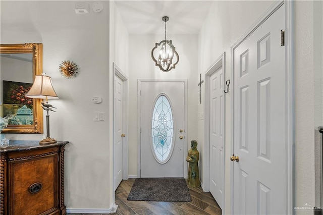 entryway featuring a chandelier