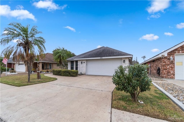 single story home with a garage and a front yard