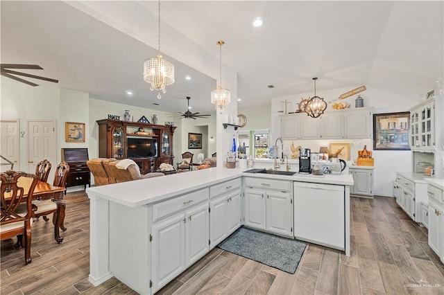 kitchen with white cabinetry, sink, white dishwasher, and hanging light fixtures