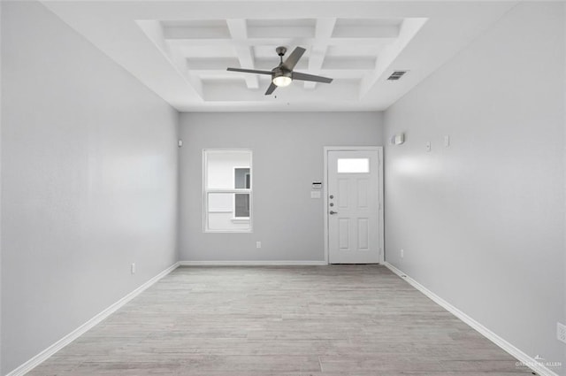 foyer entrance featuring coffered ceiling, beamed ceiling, ceiling fan, light hardwood / wood-style floors, and a high ceiling