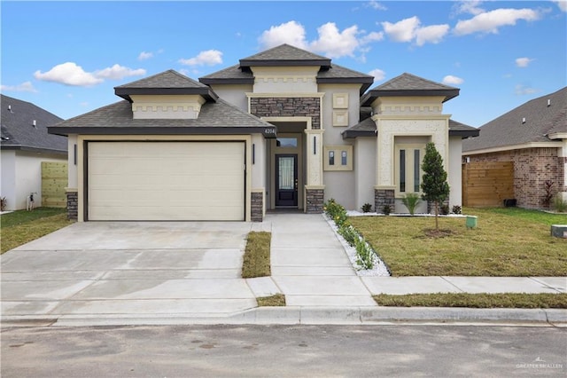 prairie-style home featuring a garage and a front yard