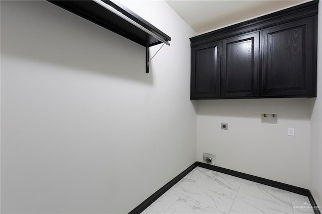 laundry room with electric dryer hookup, cabinets, and hookup for a washing machine