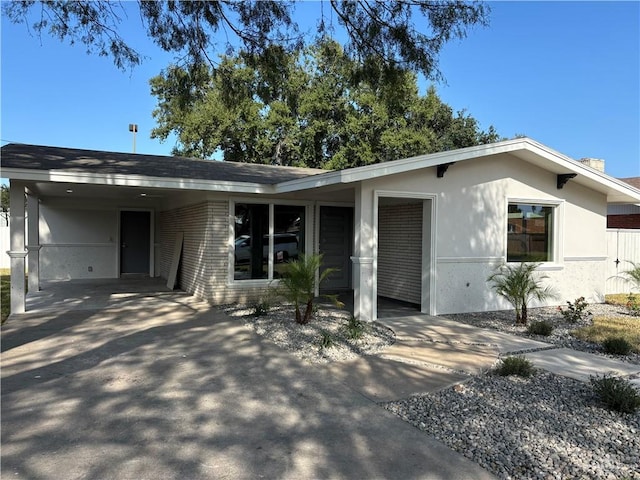 single story home with a carport