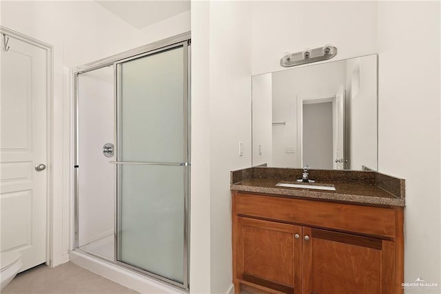 bathroom featuring vanity and walk in shower