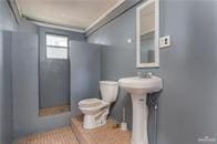 bathroom featuring toilet and sink