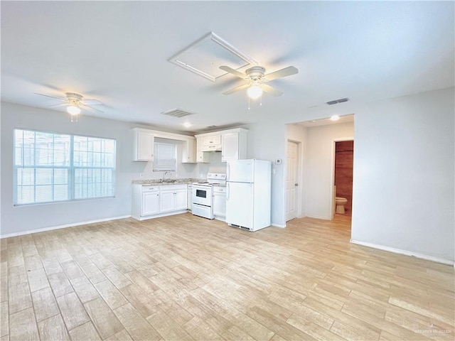 kitchen with white appliances, visible vents, ceiling fan, and light wood-style flooring