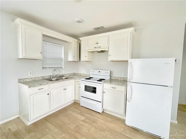 kitchen with visible vents, light wood-style floors, a sink, white appliances, and under cabinet range hood