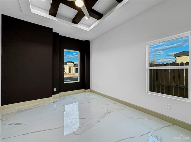 unfurnished room with beam ceiling and ceiling fan