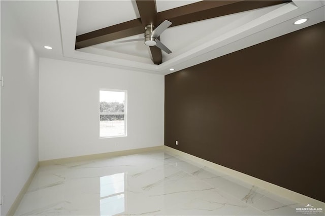 unfurnished room featuring ceiling fan and a tray ceiling