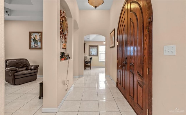 hall with light tile patterned flooring