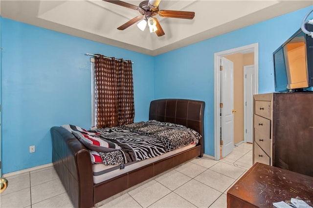 bedroom featuring light tile patterned floors and ceiling fan