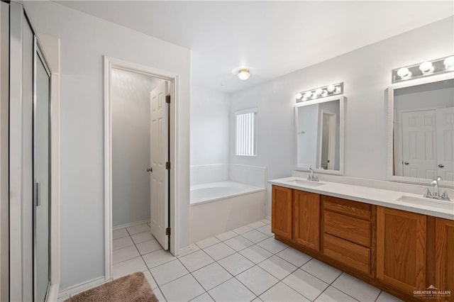 2504 Grayson Ave, Mcallen, TX 78504 - bathroom with a garden tub, double vanity, tile patterned flooring, and a shower stall