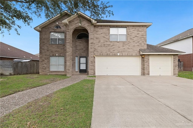 2504 Grayson Ave, Mcallen, TX 78504 - traditional home featuring concrete driveway, brick siding, and an attached garage