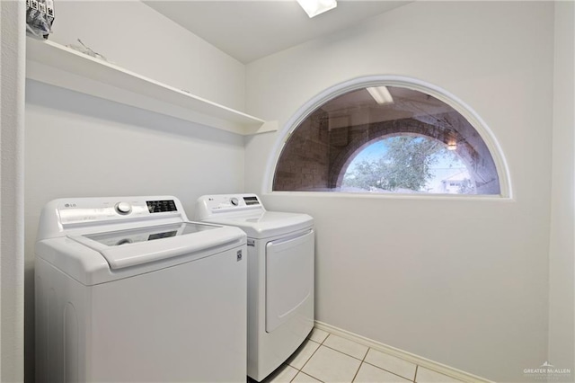 2504 Grayson Ave, Mcallen, TX 78504 - washroom with washing machine and clothes dryer and light tile patterned flooring
