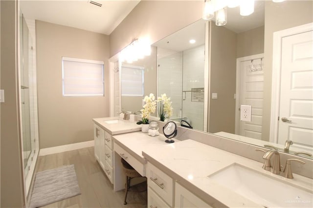 bathroom featuring vanity and walk in shower