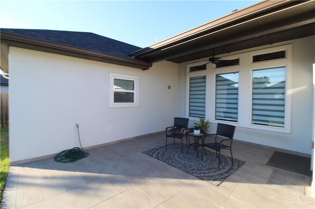 view of patio featuring ceiling fan