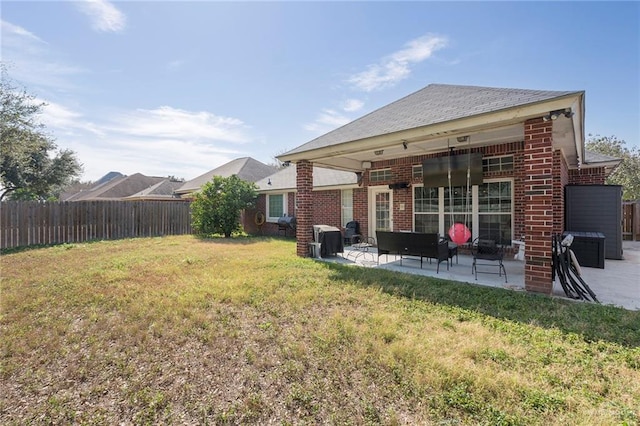 exterior space featuring a yard and a patio area