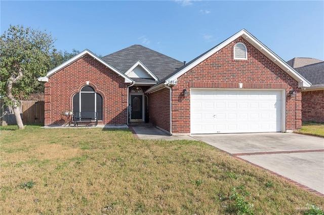 view of front of house with a garage and a front yard