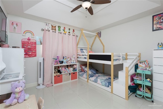 tiled bedroom featuring ceiling fan