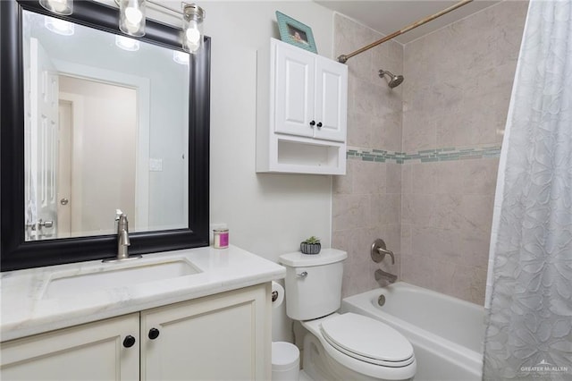 full bathroom with shower / tub combo with curtain, vanity, and toilet