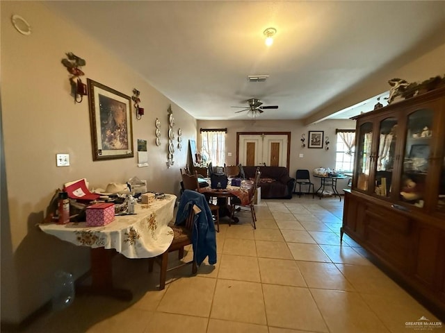 dining area featuring light tile patterned flooring and ceiling fan