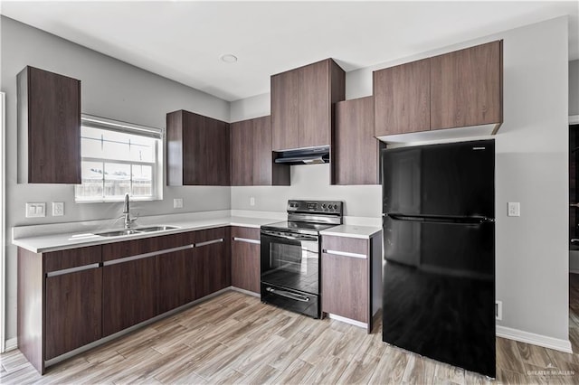 kitchen with dark brown cabinets, sink, light hardwood / wood-style floors, and black appliances