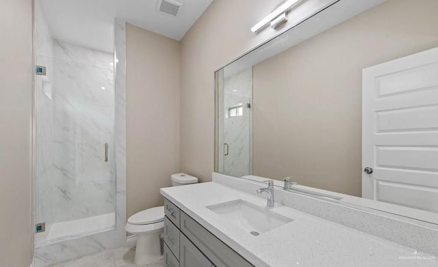 full bathroom featuring toilet, vanity, a marble finish shower, marble finish floor, and visible vents