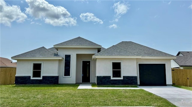 426 N Parker Rd, La Feria, TX 78559 - view of front of house with driveway, an attached garage, stucco siding, and roof with shingles