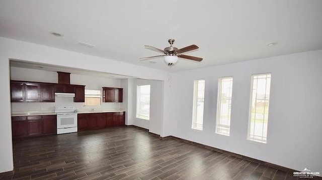 kitchen featuring dark hardwood / wood-style floors, exhaust hood, ceiling fan, and electric stove