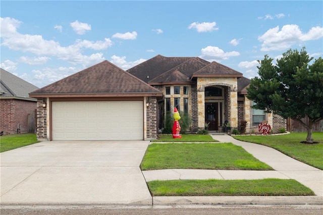 view of front facade with a garage and a front yard