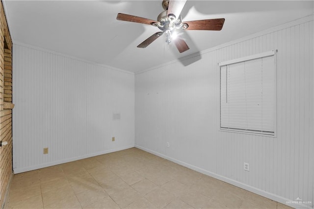 empty room featuring crown molding and ceiling fan